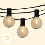 Guirlande lumineuse Goya solaire avec ampoules rondes transparentes diffusant une lumière chaude, idéale pour éclairer les soirées en extérieur sans branchement électrique.